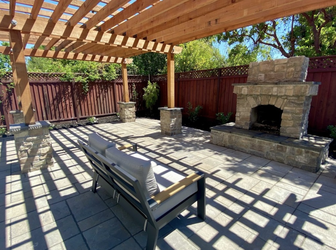 pavers, pergola, fire pit and outdoor furniture.